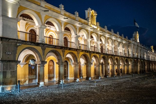 The Santa Catalina arch in Antigua, Guatemala, with a volcano behind